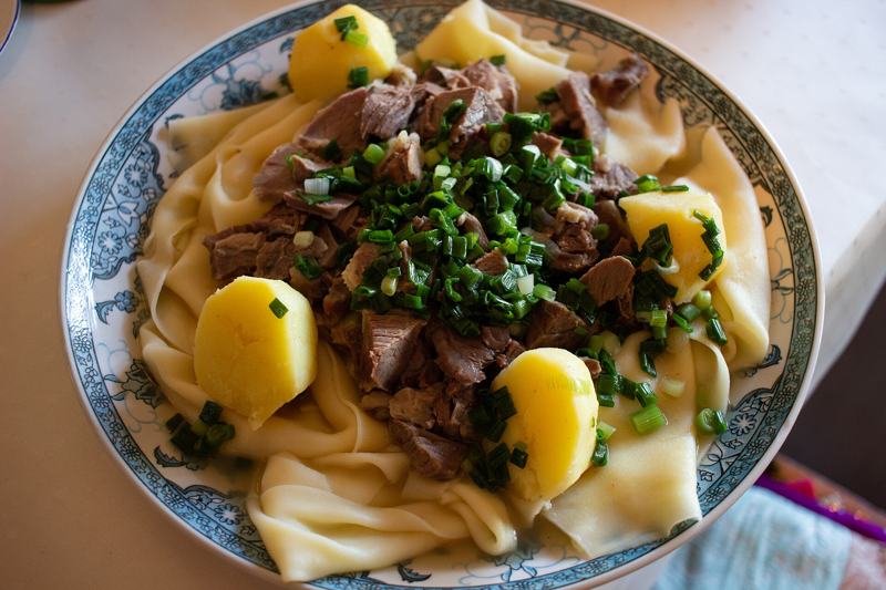 Beshbarmak, the Kazakh national dish of boiled meat on flat noodles with potatoes