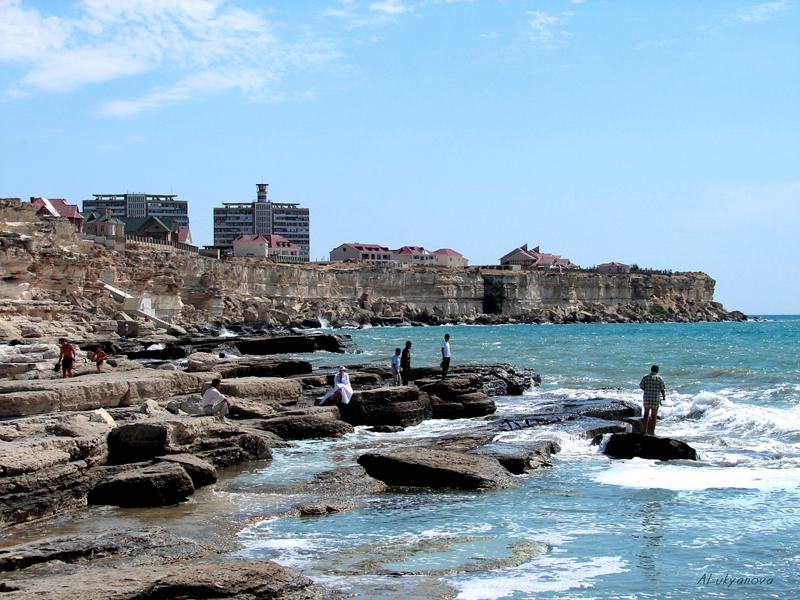 Rocky Caspian Sea shore and lighthouse in Aktau, Kazakhstan