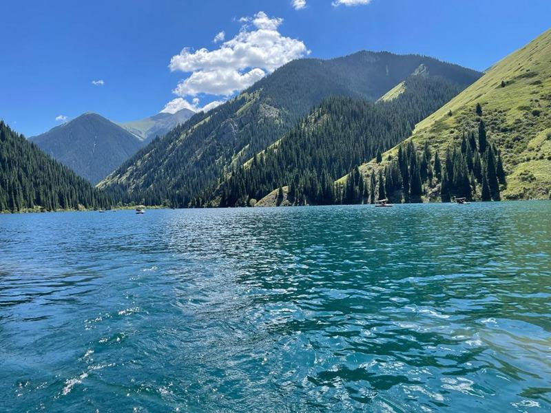 Lower Kolsai Lake in turquoise water between forested Tien Shan slopes