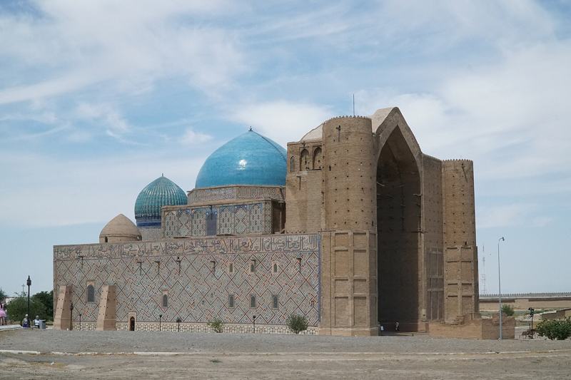 The unfinished portal and blue domes of the Yasawi Mausoleum, Turkestan